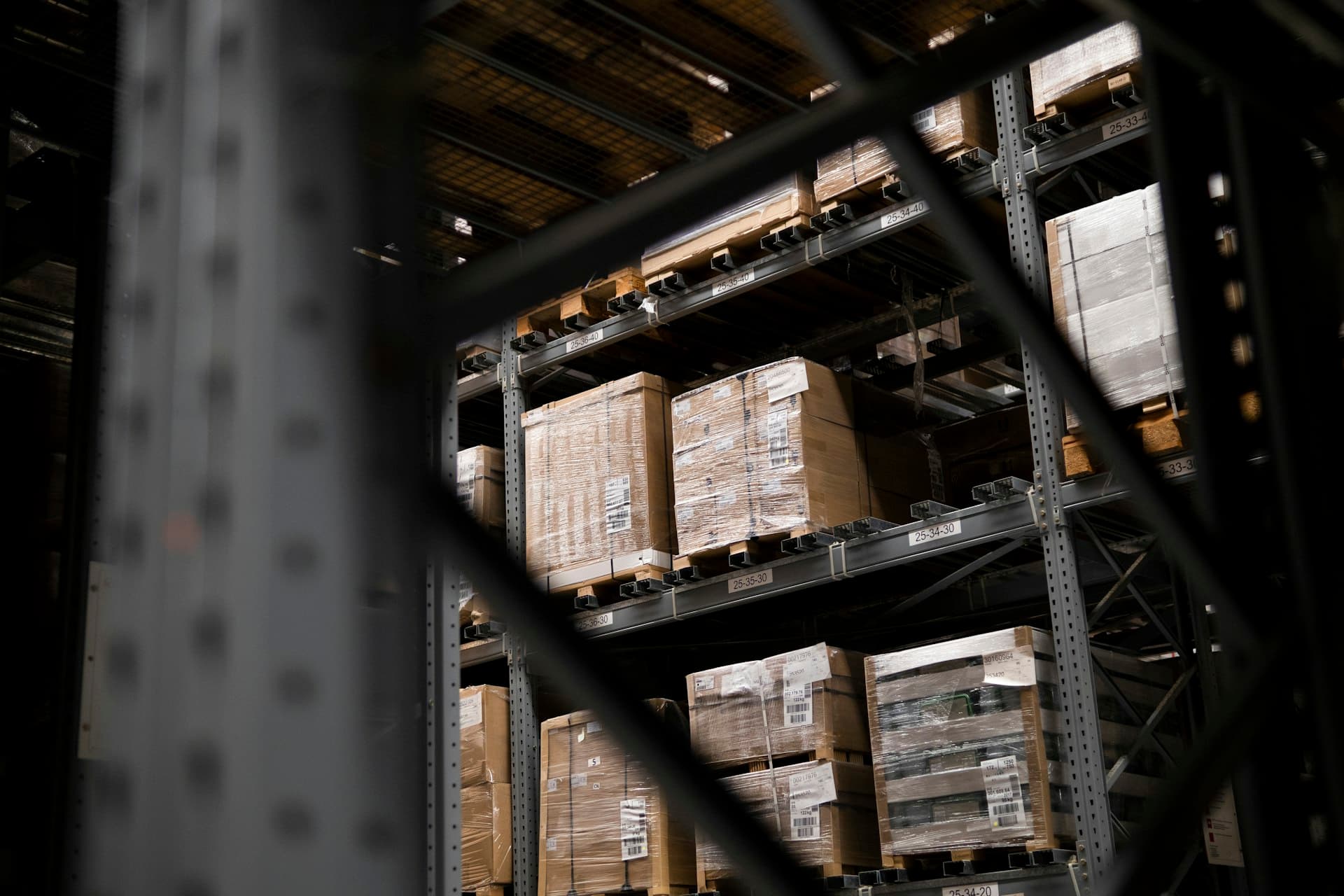 Wholesale freight warehouse with stacked pallets — RawBales SoCal operation